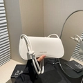Minimalist white lychee leather shoulder bag with stylish knotted strap for women - White