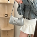 Metallic silver bow shoulder bag featuring a glossy finish and vintage y2k style buckle - Silver