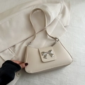 Chic beige underarm bag in matte leather with a mirror-finish silver bow metal clasp - White