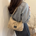 Beige large nylon crossbody tote bag with adjustable strap and textured fabric - Khaki