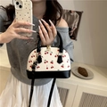White bucket bag with cherry print, black accents and gold hardware details - Black