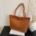 Bruine vintage leren shopper met reliëfletters en een gouden metalen logo-plaatje - Bruin