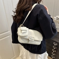 Minimalist white lychee grain shoulder bag with small coin purse worn by model - White