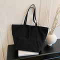 Schwarze Canvas-Einkaufstasche mit Prägetext und großem Fassungsvermögen für den Alltag - Schwarz
