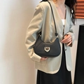 Chic black half-moon underarm bag with gold D-ring buckle and knotted strap detail - Black