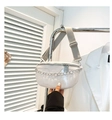 Detailed view of white PU leather chest bag with silver chain and adjustable nylon strap - White