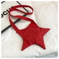 Detailed view of red star-shaped crossbody bag with quilted nylon fabric and strap - Red