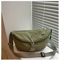 Detail of olive green nylon crescent bag with double zippers and metal logo on strap - Green