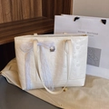Fashionable white embossed large tote bag with lace bow accessory in a cozy home setting - With Silk Scarf / Beige