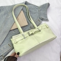Chic mint green leather baguette bag with silver buckle and stylish shoulder strap - Green