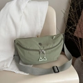 Sage green nylon crossbody bag with gray adjustable strap and triangular zipper pull - Green