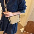 Minimalist beige pleated nylon crossbody bag with adjustable wide shoulder strap and metal logo - Khaki