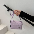 Light purple nylon crossbody bag with adjustable strap and metallic M logo detail - Purple