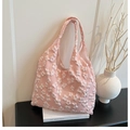 Detail of pink floral lace tote bag featuring 3D texture and wide integrated handles - Pink