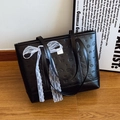 Black tote bag with embossed puppy patterns and delicate white lace ribbon detail - With Silk Scarf / Black