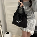 Black casual drawstring tote bag with white art lettering for a stylish look - Black