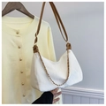Close-up of white shoulder bag with brown strap and gold chain on a wooden hanger - Off White