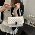 White quilted leather crossbody bag with V-pattern stitching and silver chain strap - White