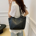 Classic black tote bag with wrinkled faux leather texture and gold buckle detail - Black