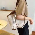 Women's woven tote bag with brown leather trim and stylish webbing straps in a minimalist room - White with Brown