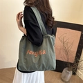 Dark green canvas tote bag featuring orange Fanyissa print and spacious design - Dark Green