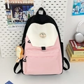 Pink and white patchwork canvas backpack for women with toast plush charm on white pegboard - Black & Pink With Bread Pendant