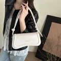 Minimalist beige leather handbag for women featuring unique knotted straps and arc-shaped bottom - White