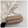 Detail of light brown baguette bag with gold Fashion & Bags lettering and smooth texture - Khaki