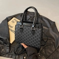 Chic black square handbag with M-letter monogram print and elegant gold lettering - Black