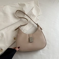 Chic beige half-moon hobo bag with silver geometric buckle and adjustable strap - Khaki