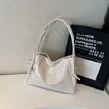 Chic cream-colored glossy tote bag with stylish drawstring knots and pleated details - Beige