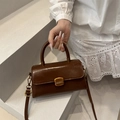 Dark brown vintage crossbody bag in glossy PU leather with retro gold buckle detail - Dark Brown
