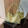 Minimalist light green pleated tote bag with thin knotted shoulder straps and soft texture - Green