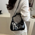 Black crescent bag with gathered handle, pearl bow charm, and chain strap detail - Black With Pearl Pendant
