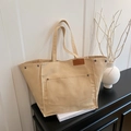 Minimalist beige canvas tote bag with front pocket and faux leather patch detail - Khaki