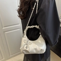 White faux leather shoulder bag with pleated handle, chain strap, and pearl bow charm - White With Pearl Pendant