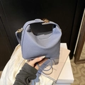 Blue textured mini top handle bag with gold snap closure and slim adjustable strap - Blue