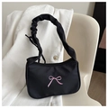 Detail of black underarm bag featuring pink bow embroidery and a ruched scrunchie strap - Black