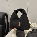 Sac à main minimaliste en toile noire avec poignée nouée et étiquette en cuir brun - Toile / Noir