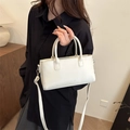 White minimalist square leather crossbody bag featuring embossed fashion logo and slim strap - White
