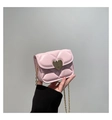 Macro detail of a mini pink quilted bag with a gold heart lock and elegant chain strap - Pink