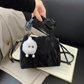 Black pleated bucket bag with a white plush cloud charm and fine gold hardware - With White Eye Pendant / Black