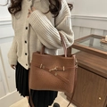 Brown woven texture tote bag with golden buckle and adjustable shoulder strap for women - Brown