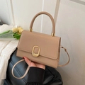 Beige structured mini handbag with gold oval hardware and elegant top handle strap - Khaki