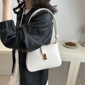 Chic white baguette underarm bag with minimalist gold buckle and sleek leather strap - White