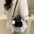 Black quilted mini bucket bag with silk scarf handle and plush monster charm - Black With White Long-Legged Pendant