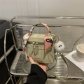 Light green textured mini handbag with silk scarf handles and plush monster charm - Green With Long Leg Plush Charm