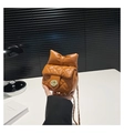 Detail of caramel quilted mini bag with bow decoration and gold metal chain strap - Brown
