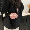 Pink shell-shaped crossbody bag with decorative pearl chain and adjustable strap - Pink