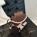 Dark brown shell bag with pearl chain handle and vertical textured faux leather finish - Brown